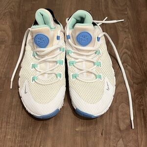 Nike White Athletic Shoes with Light Blue and Mint Accents